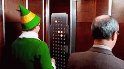 A clip from the movie Elf, showing a grown ass man awkwardly rubbing his hands over all the buttons in an elevator, about to immediately proclaim to the poor soul next to him that the lit pattern looks like a Christmas tree.
